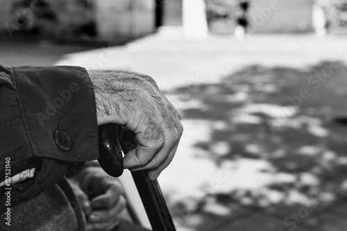 old man with a walking stick, black and white