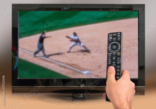 Photography Man is watching baseball match on TV