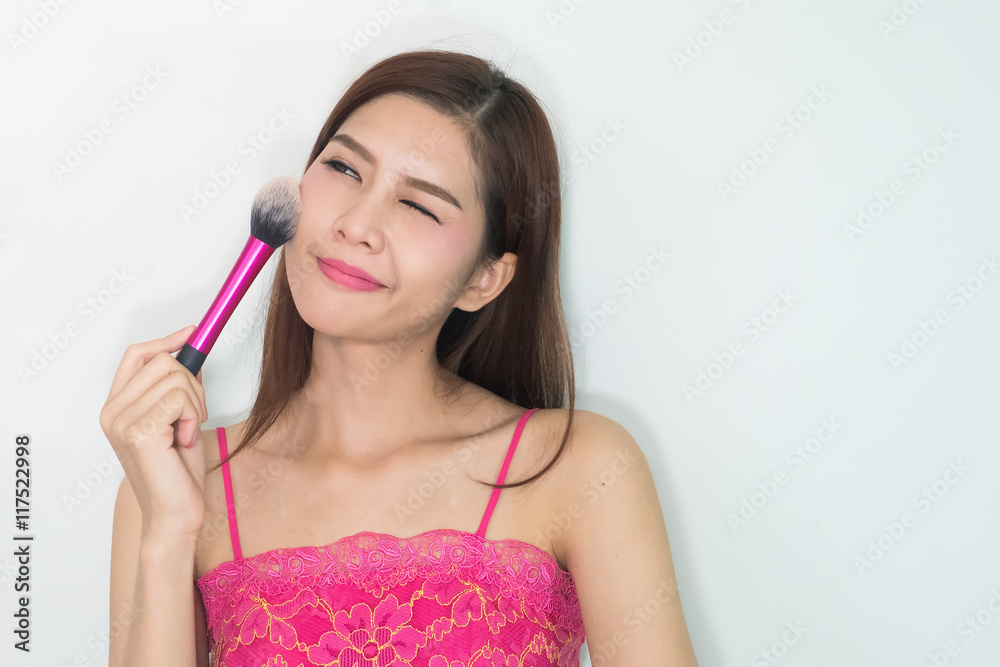 Closeup portrait picture of beautiful woman with brushes Closeup portrait picture of beautiful woman with brushes