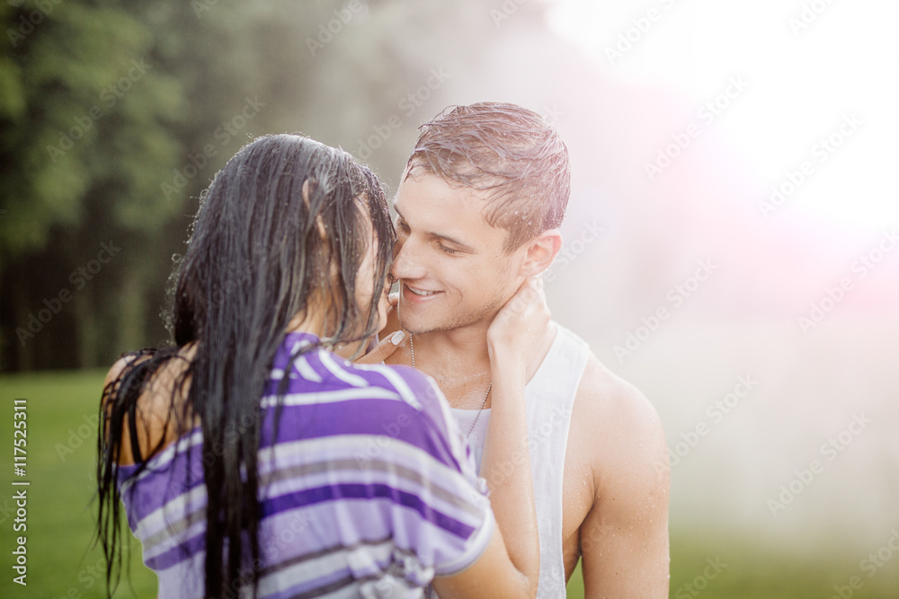 young couple in love having fun and enjoying the beautiful nature.Young couple in the rain young couple in love having fun and enjoying the beautiful nature.Young couple in the rain