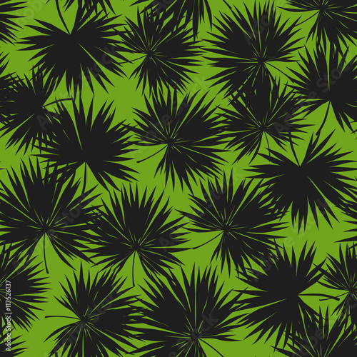 Seamless ornament with palm leaves. Texture. Background. Repeated pattern. Summer style. Nice background for your projects. Desktop wallpapers.