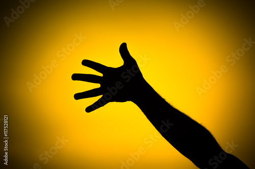 Silhouette of a team of people hands shows gesture ok