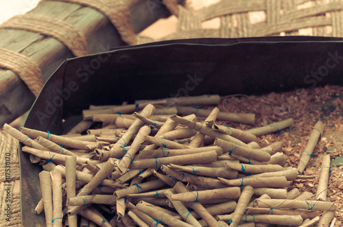 The beedi is a thin, Indian cigarette filled with tobacco flakes and wrapped in  Bauhinia racemosa leaf  tied   string at one end.