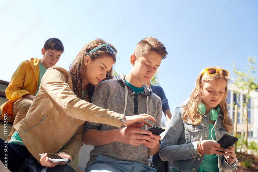 teenage friends with smartphone and headphones teenage friends with smartphone and headphones