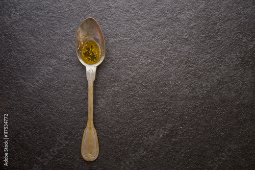 Olive oil in vintage spoons