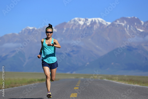 healthy lifestyle young fitness woman runner running on road