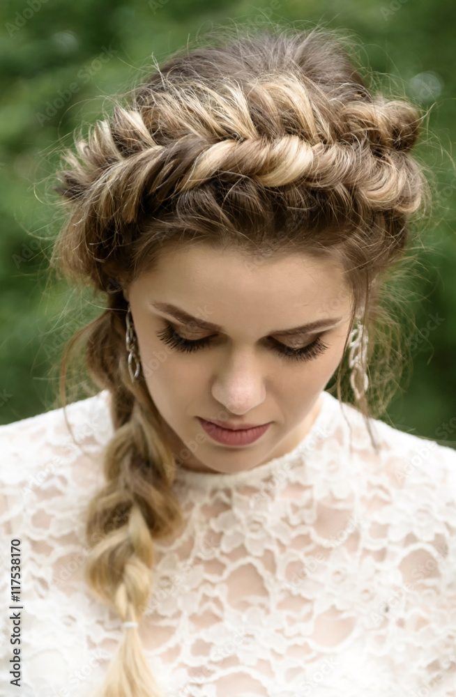 Girl in a beautiful white dress. young friendly girl looking in the camera. Young girl smiling Girl in a beautiful white dress. young friendly girl looking in the camera. Young girl smiling