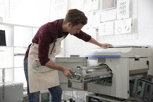 Young Man Working In Screen Printing Business