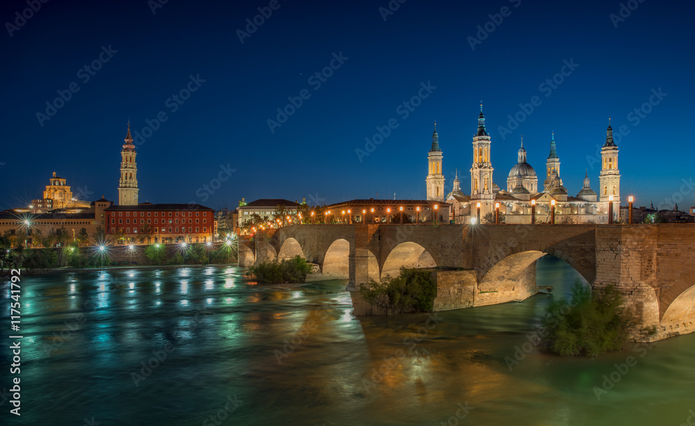 Basilica Our Lady Pillar In Zaragoza And the Bridge In Spain At Night