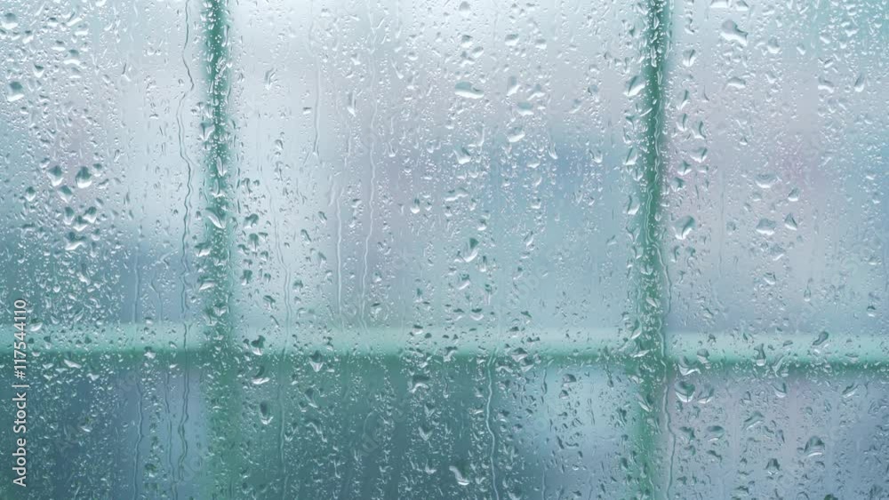 real rain drops sliding on window glass real rain drops sliding on window glass