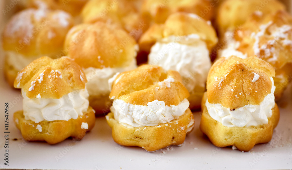 Cream puff cakes with whipped cream Cream puff cakes with whipped cream