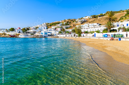 View of beautiful beach with turquoise sea water in Mykonos port, Mykonos island, Greece photo