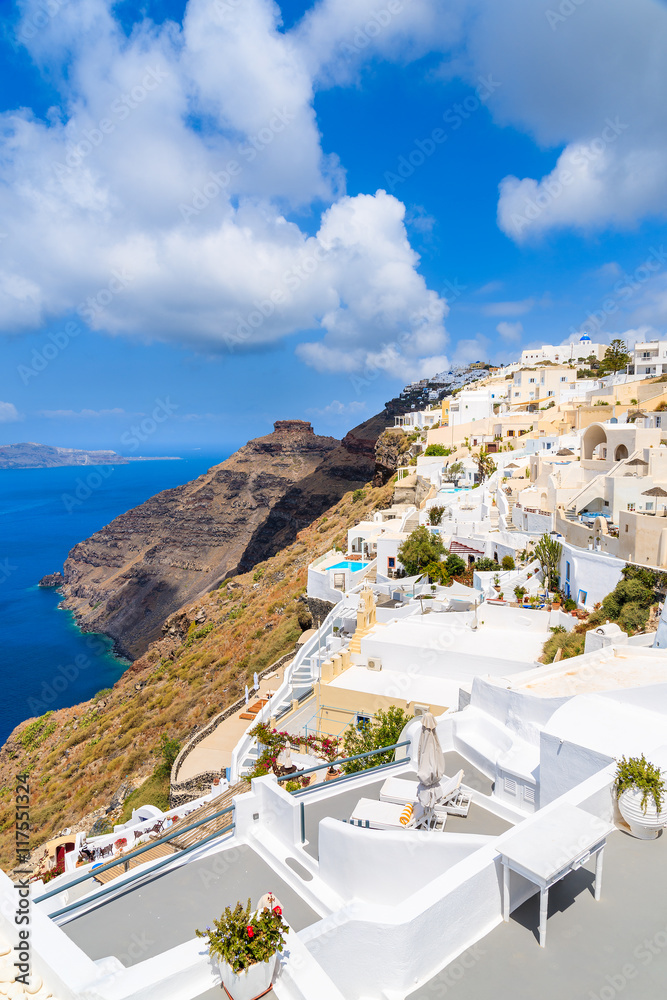 Naklejka premium Typical Greek architecture in Firostefani village and view of volcano caldera, Santorini island, Greece