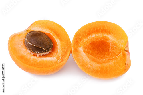 Apricot with fruit kernel on white background. Closeup.