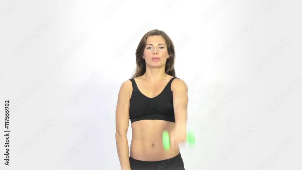Sports girl does exercise with dumbbells Sports girl does exercise with dumbbells
