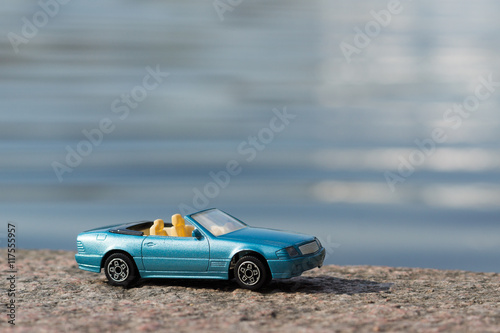 Blue Car against Water Background