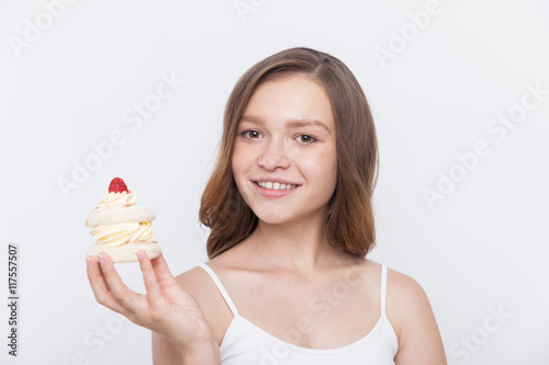 Smiling girl holding cupcake