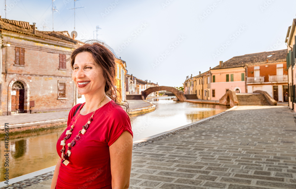 woman on the canals of ancient village
