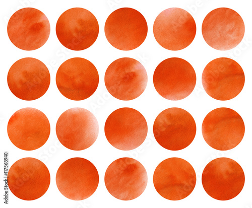 Watercolor circles in orange color isolated over white.