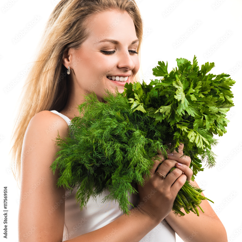 Portrait of a beautiful happy young woman with a bouquet of fresh greenery - parsley and dill Portrait of a beautiful happy young woman with a bouquet of fresh greenery - parsley and dill