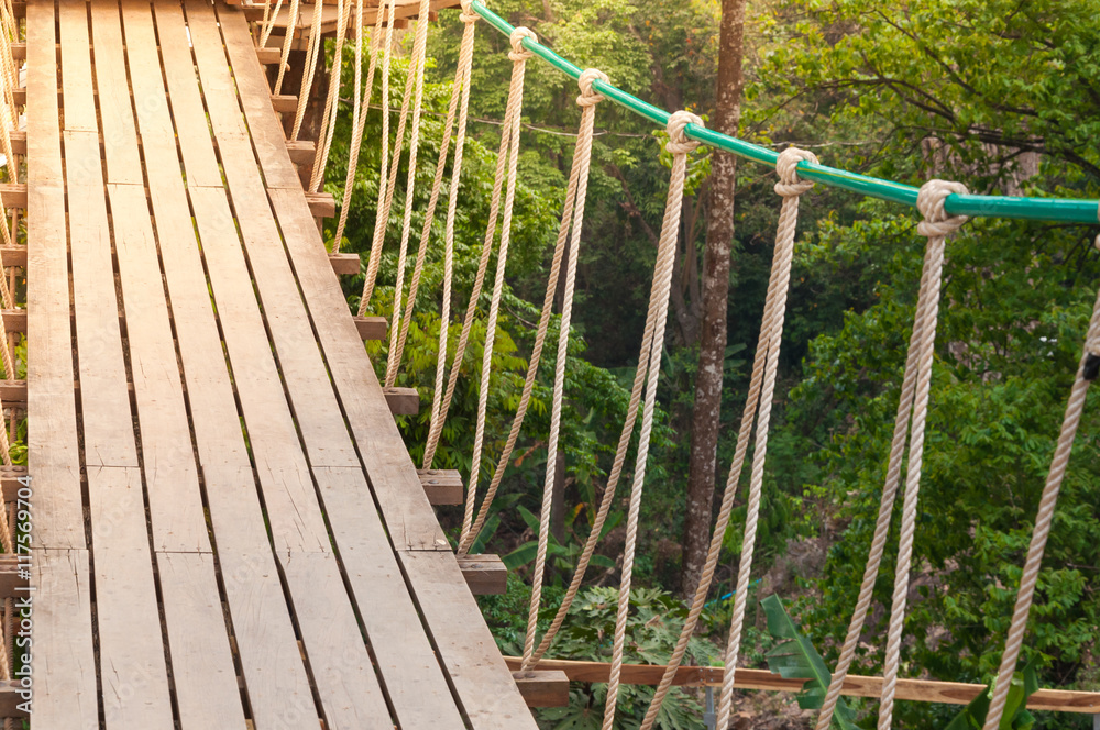 Suspension bridge, walkway to the adventurous, cross to the other side forest Suspension bridge, walkway to the adventurous, cross to the other side forest
