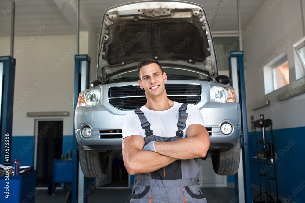 Portrait of strong smiling mechanic Portrait of strong smiling mechanic