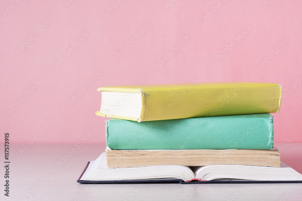 Open book, hardback books on wooden table. Education background. Back to school. Copy space for text. Open book, hardback books on wooden table. Education background. Back to school. Copy space for text.