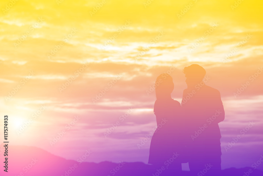 Young couple in love at sunset on the Mountain
