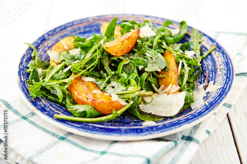 Vegetarian gourmet salad with arugula and peaches