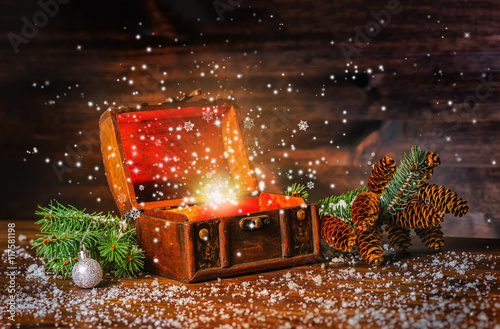 Christmas winter fairy with fantasy miracle in opened chest trea