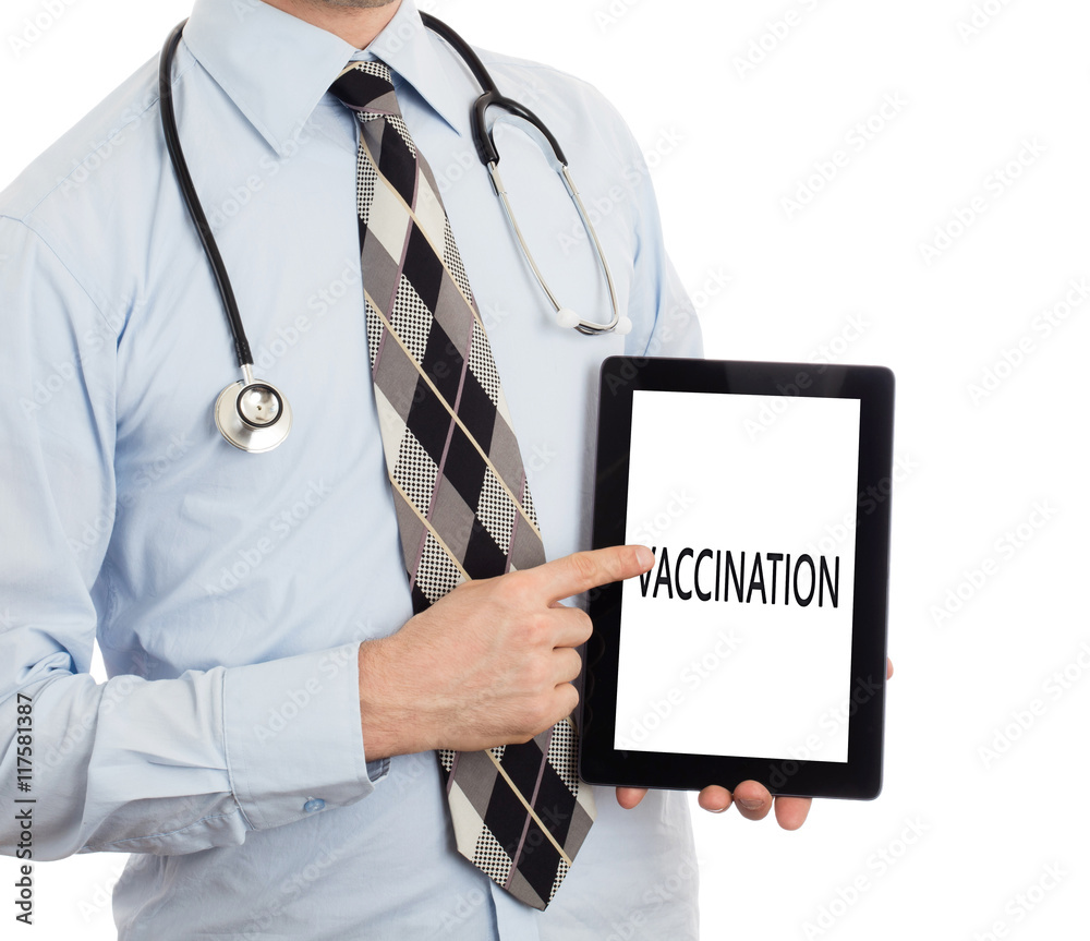Doctor holding tablet - Vaccination Doctor holding tablet - Vaccination