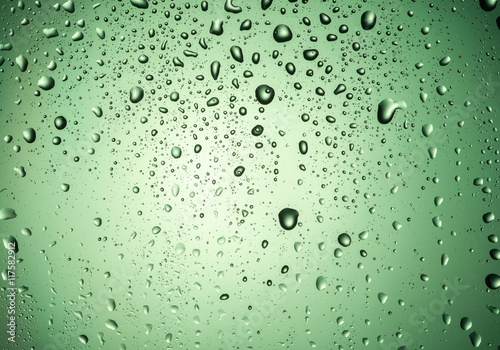 Drops on the glass with a green glow