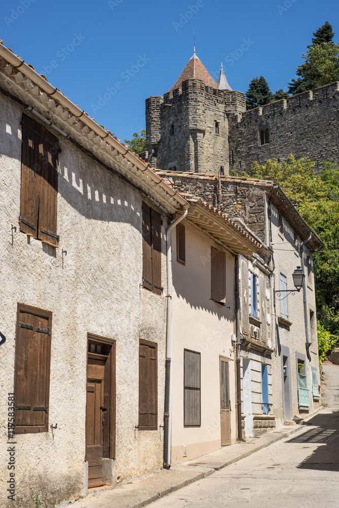 Old street of historical part of Carcassonne below the castle fortress 