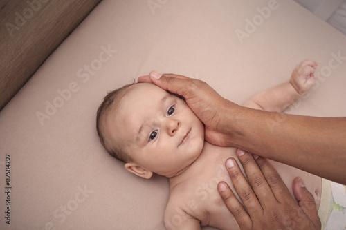 Interracial father calming his baby