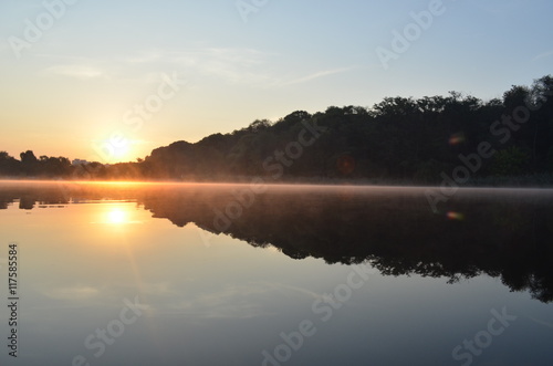 Fototapeta Naklejka Na Ścianę i Meble -  Sunrise above the lake in the forest