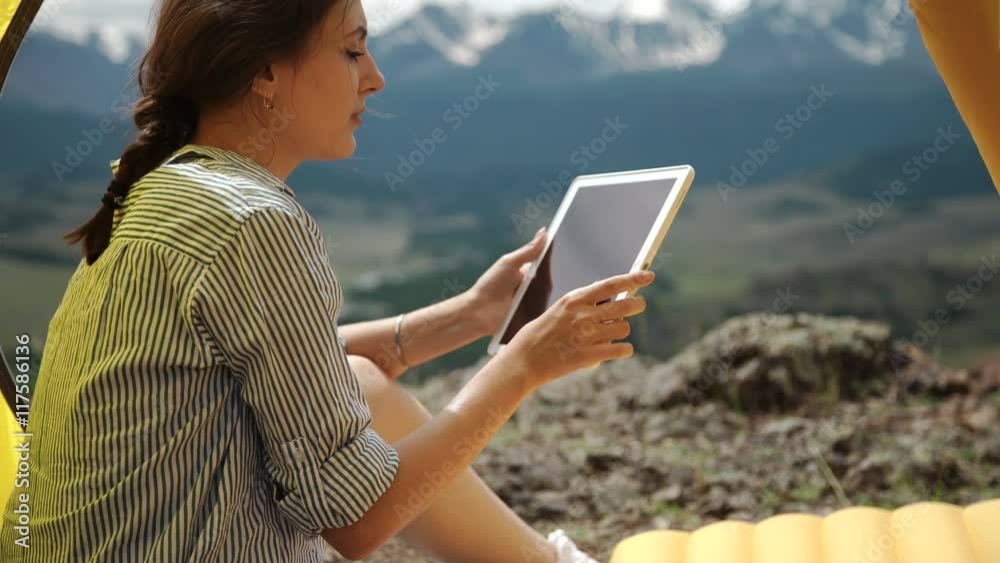 Girl taking pictures on a tablet. Girl taking pictures on a tablet.