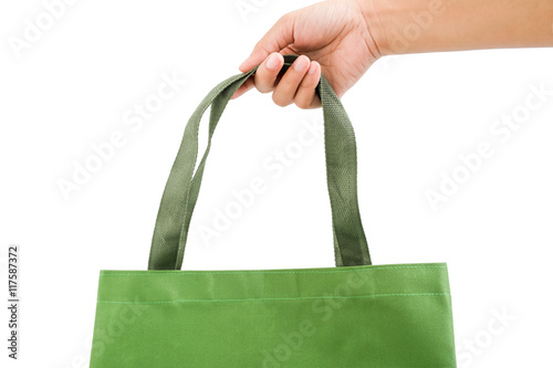 Isolated woman right hand hold a dark green shopping bag