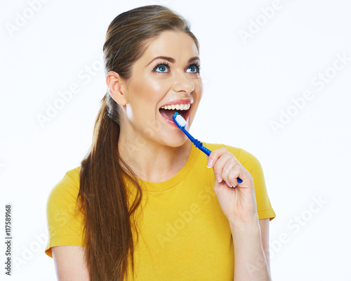 Girl brushing teeth. young woman with toothy brush.