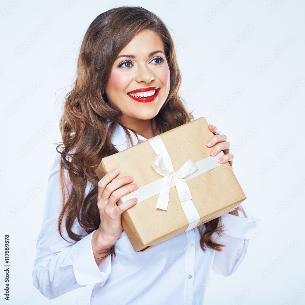 Smiling woman with long curly hair holding paper gift box. Smiling woman with long curly hair holding paper gift box.
