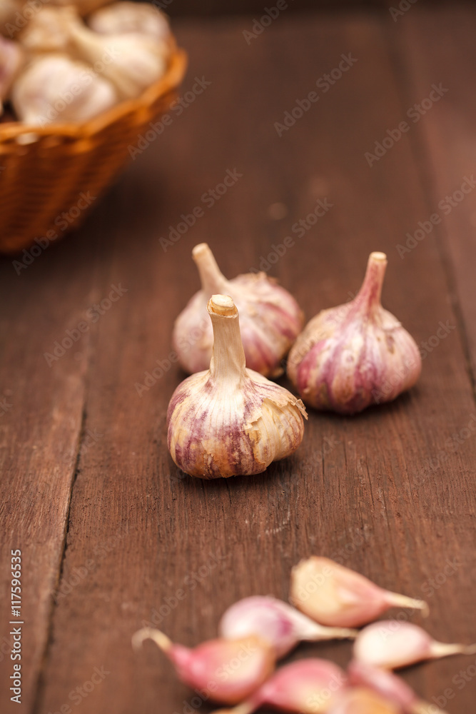 garlic cloves on a wooden background