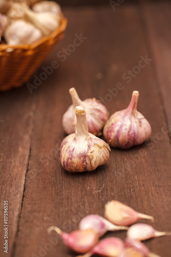 garlic cloves on a wooden background