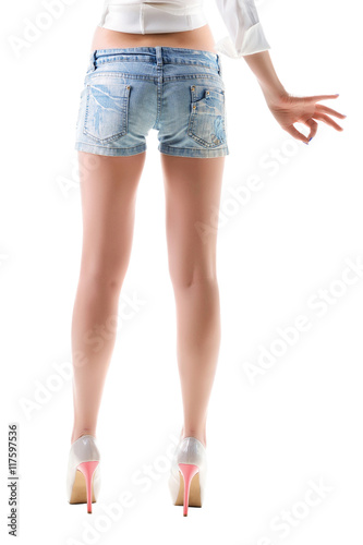 Close-up of woman legs in jeans shorts.