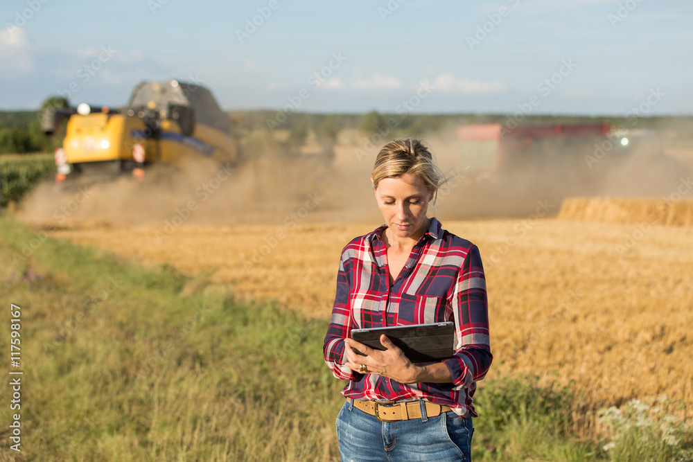 female farmer using electronics