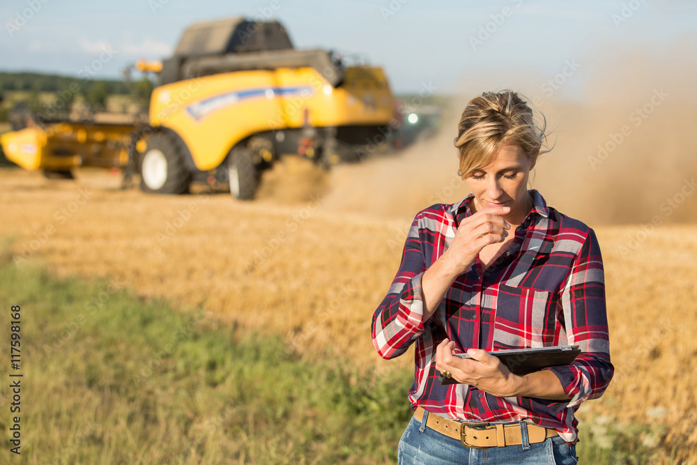 female farmer using electronics female farmer using electronics