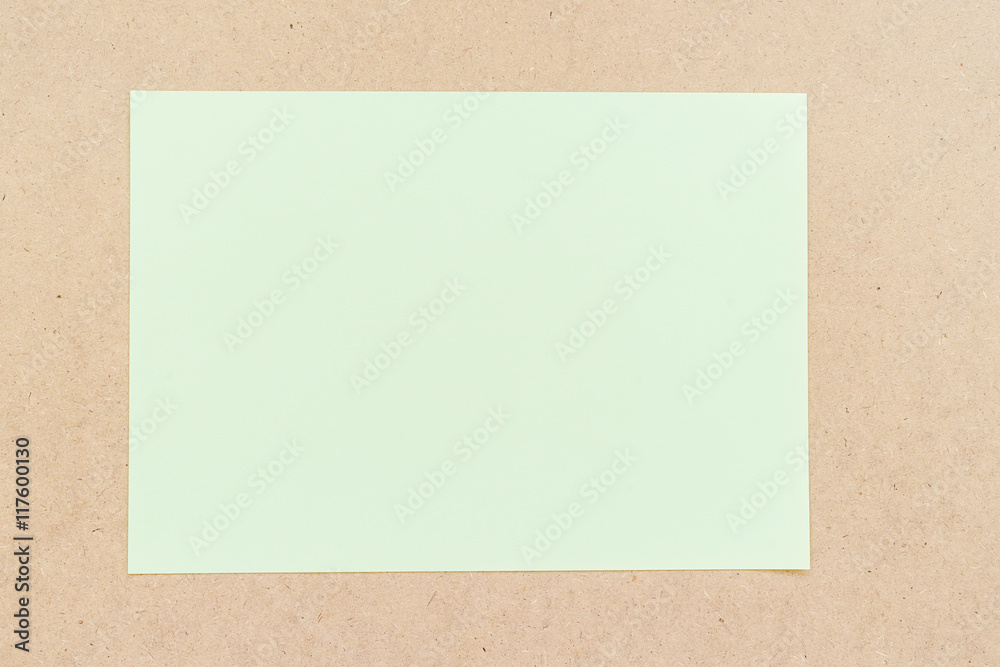 Office table with green paper sheet Office table with green paper sheet