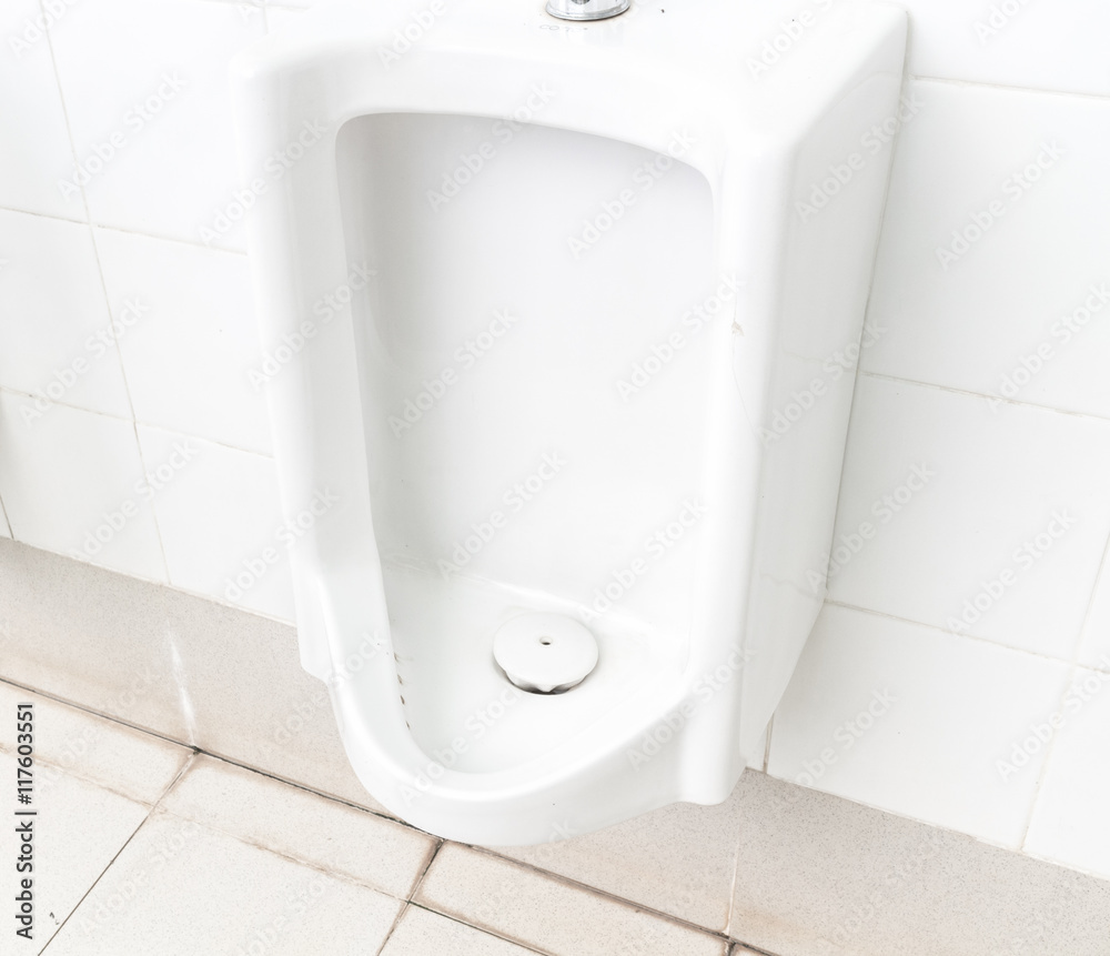 Fototapeta premium Closeup urinals white color in men's public restroom, healthy concept