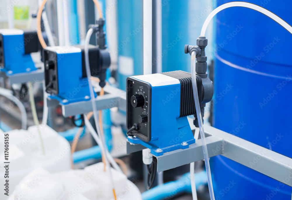 Chemical pump used in wastewater treatment,water filtration plants.the feed  pump chemical into the pipe water.blur background. Stock Photo | Adobe Stock