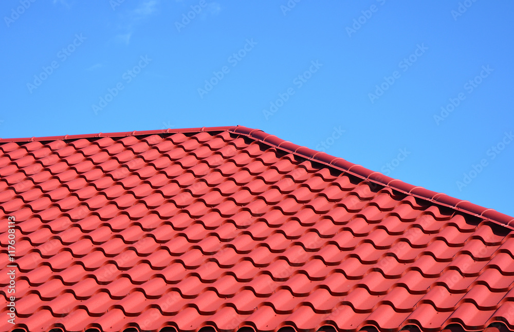 New red metal tiled roof house roofing construction exterior.