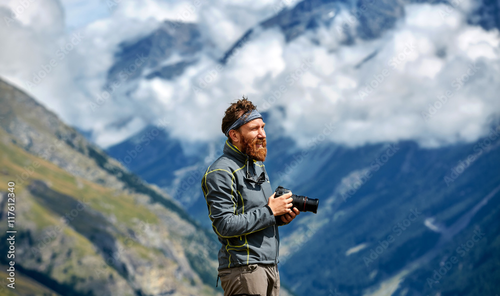 hiker at the top of a pass with camera enjoy sunny day in Alps. Switzerland, Trek near Matterhorn mount. hiker at the top of a pass with camera enjoy sunny day in Alps. Switzerland, Trek near Matterhorn mount.
