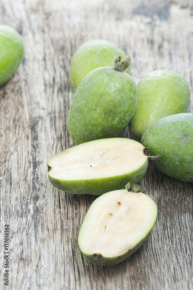 fresh feijoa fruits on a wooden background
